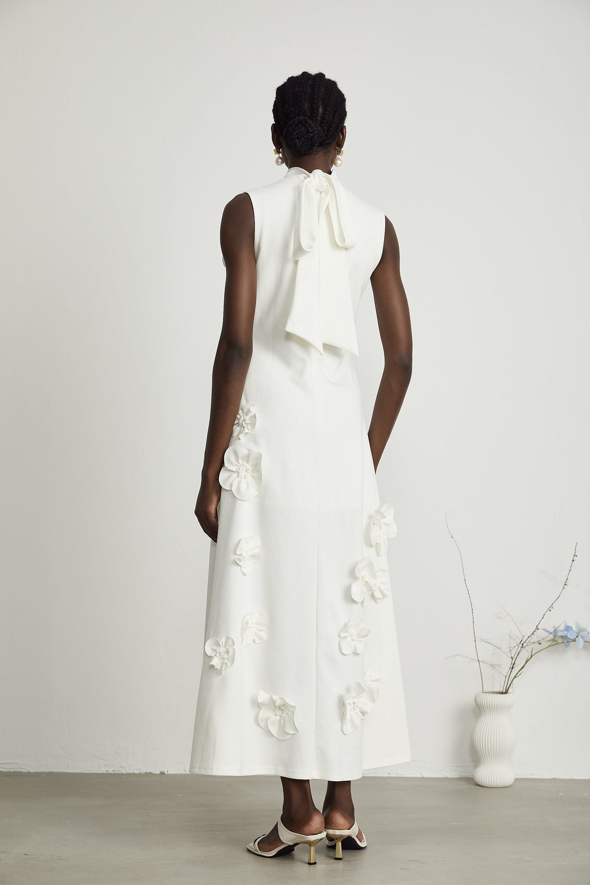 Magali White Sleeveless Maxi Dress with Faux Flower & Bow-Tie Embellishment