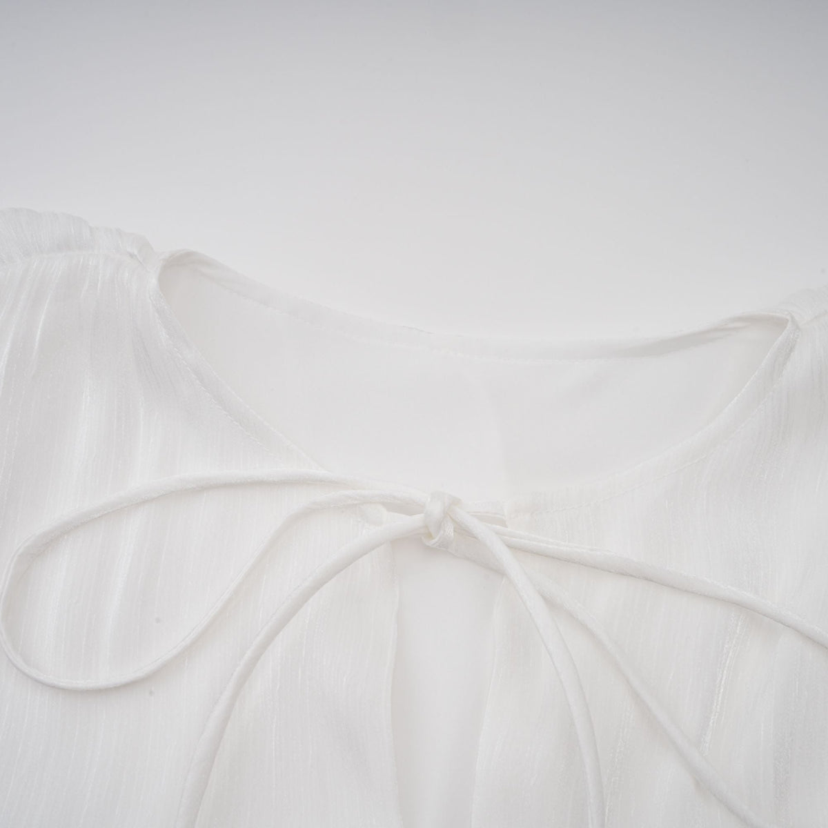 Mahault white pleated glitter-effect mini dress